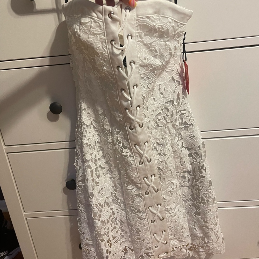 White lace tie up dress NEVER WORN from forever 21. Still has original tags on.